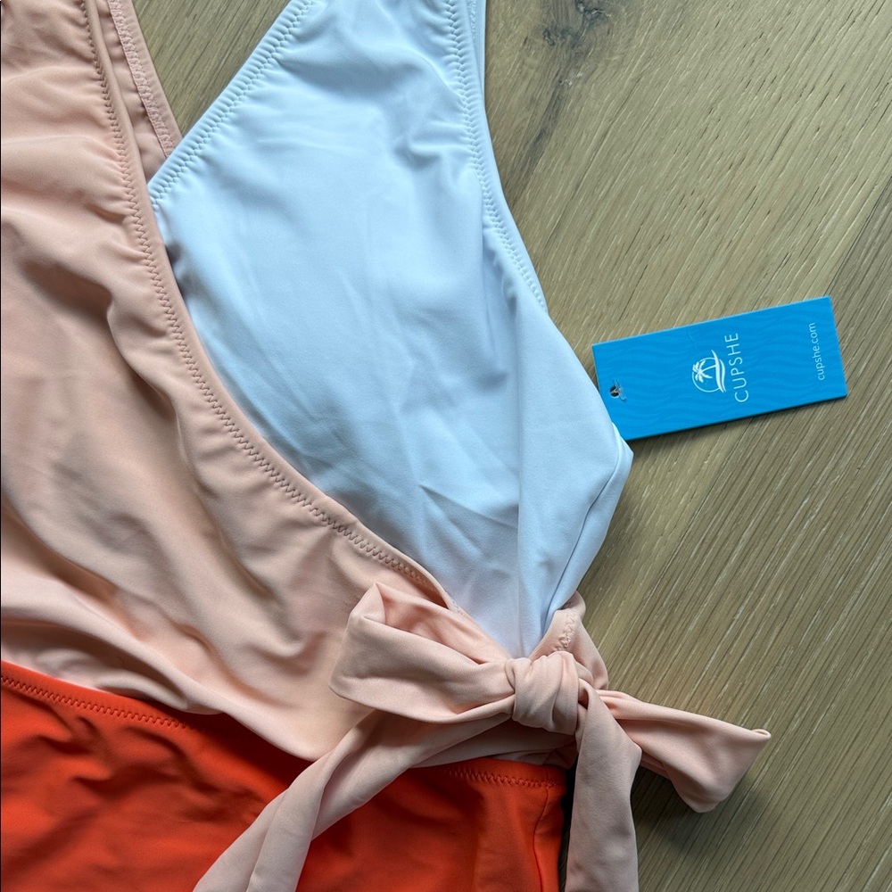Cupshe Peach and White Swimsuit with Bow Detail large one piece.